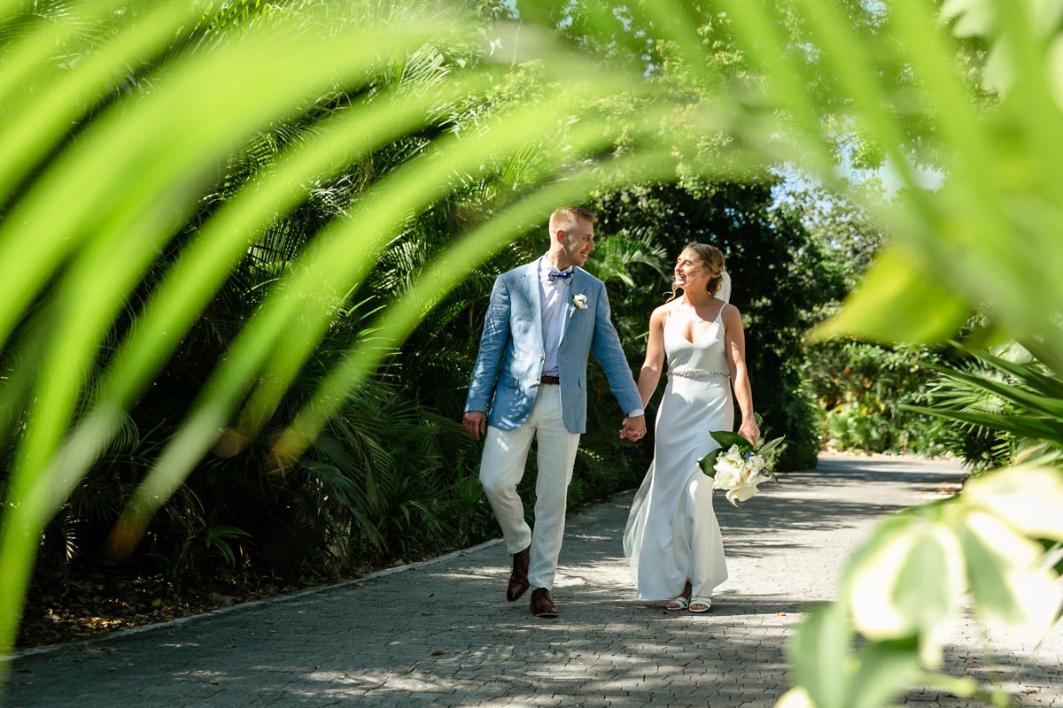 NewlywedsStrollOnGardenPath
