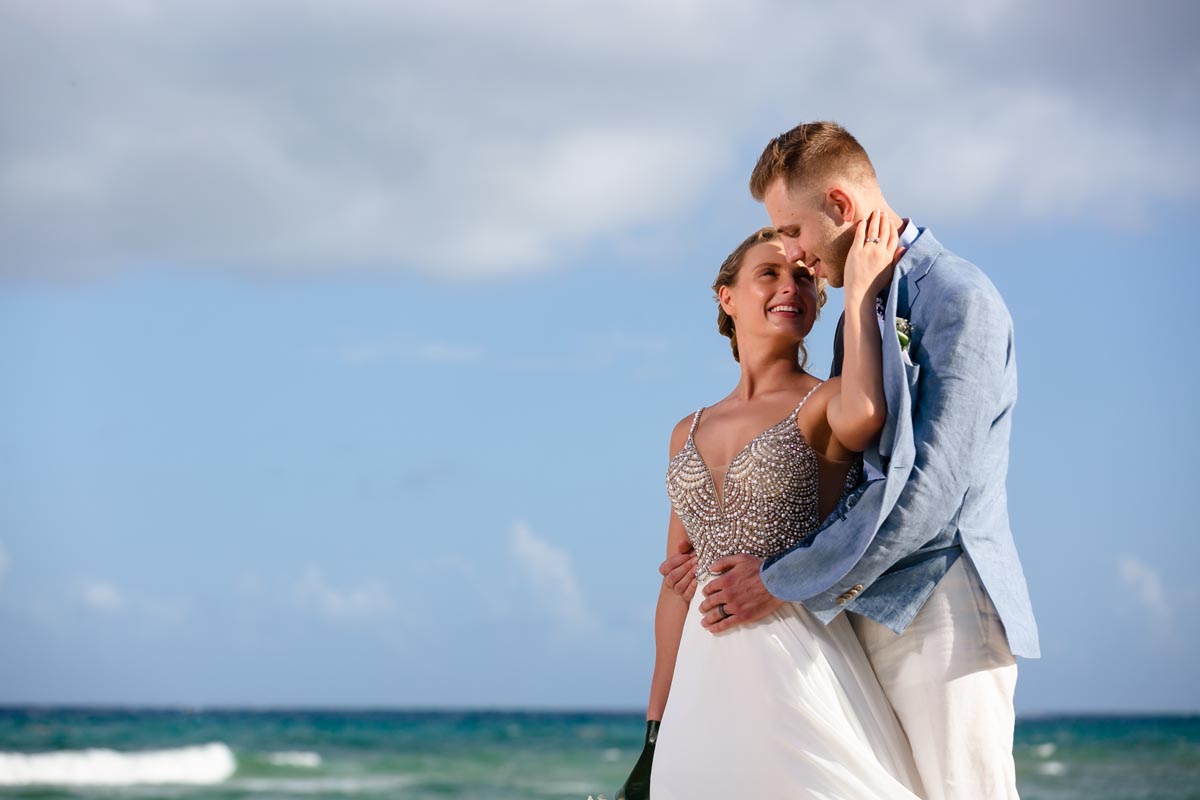 SandosPlayacarNewlywedsEmbraceOnBeach