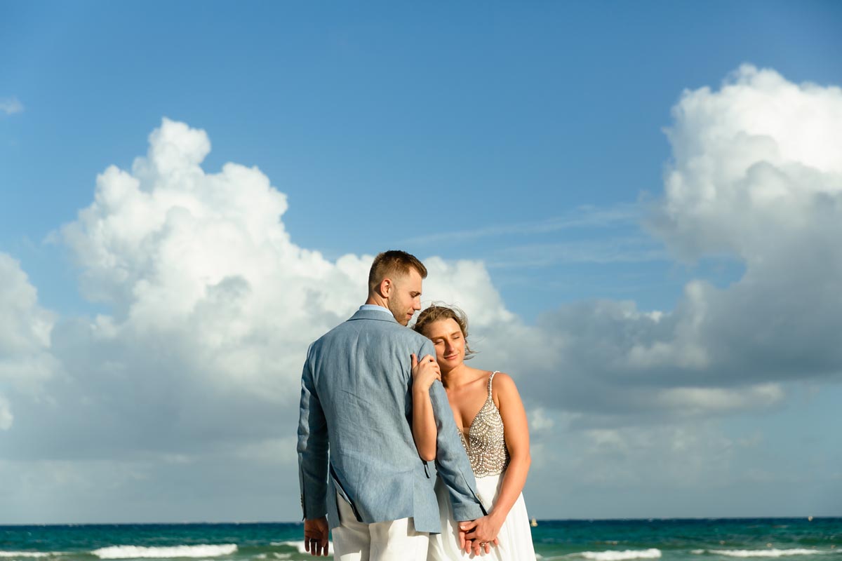 SandosPlayacarNewlywedsEmbraceOnBeach