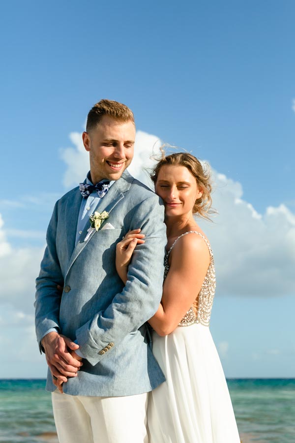 SandosPlayacarNewlywedsEmbraceOnBeach