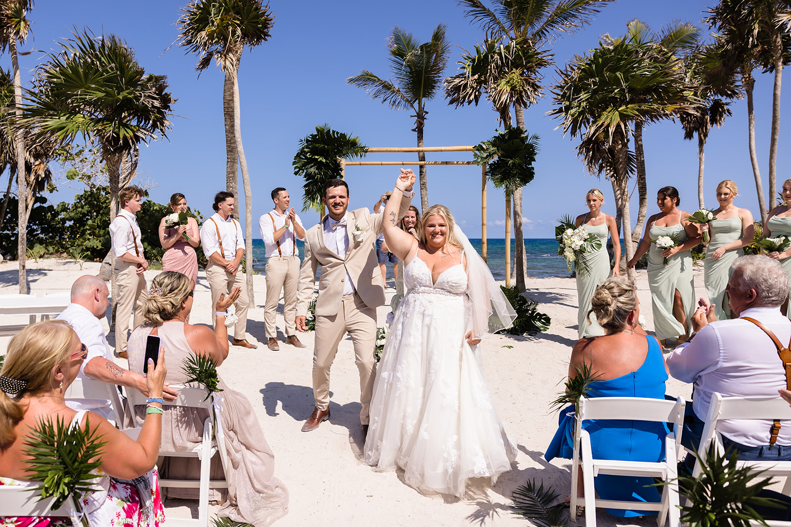 Newlyweds cheer walking out after ceremony