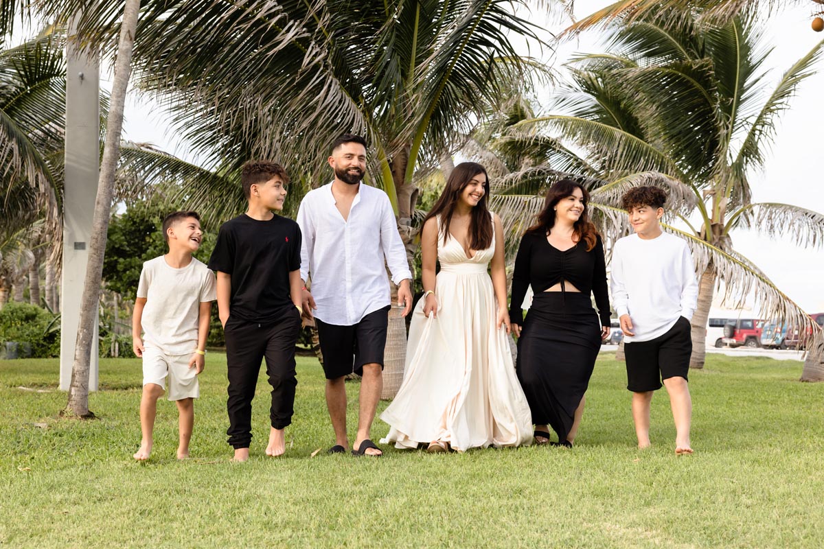 Carina strolls with her family in the Cancun jungle