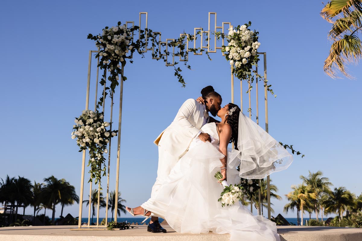 Newlyweds dip in a kiss after ceremony