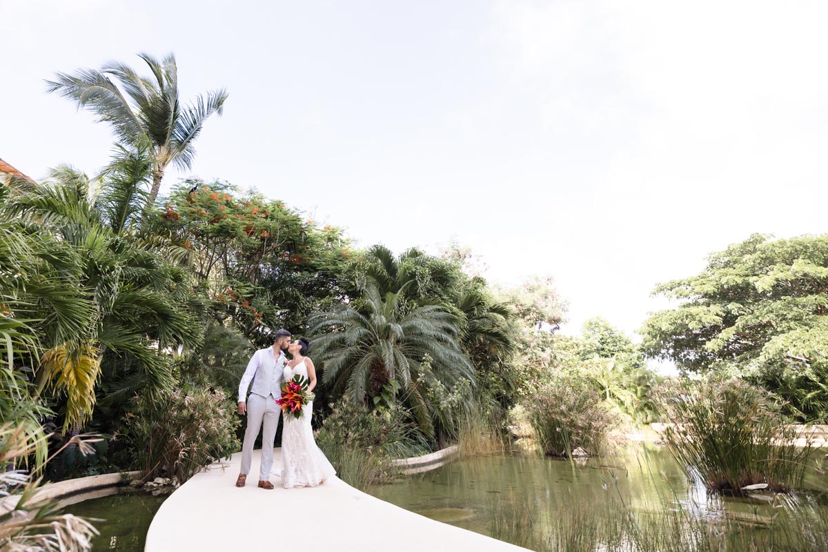 Wedding couple kiss on their way to the ceremony after emotional first look