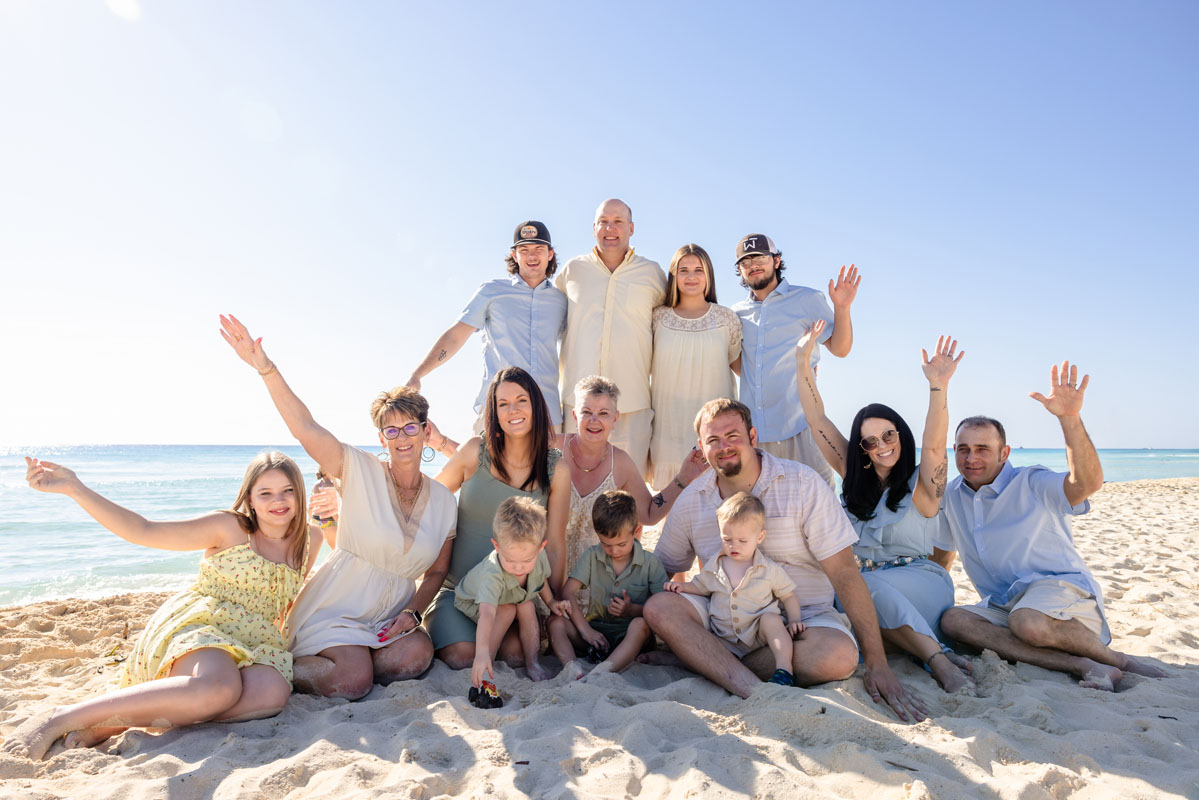 Shayo's family cheers sitting on beach together